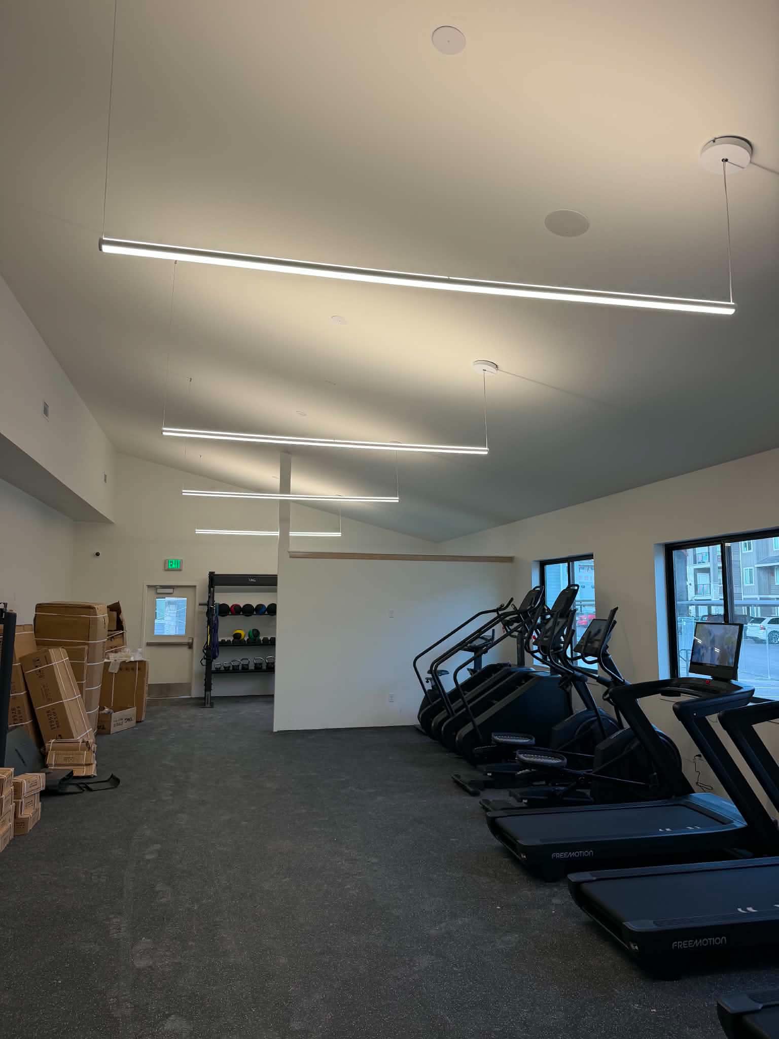 Suspended linear LEDs in a fitness room